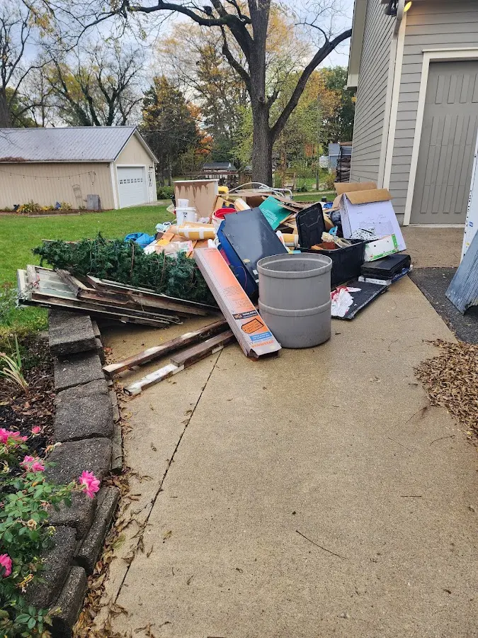 Dumpster being loaded with debris for 30 Yard Dumpster Rental in San Mateo